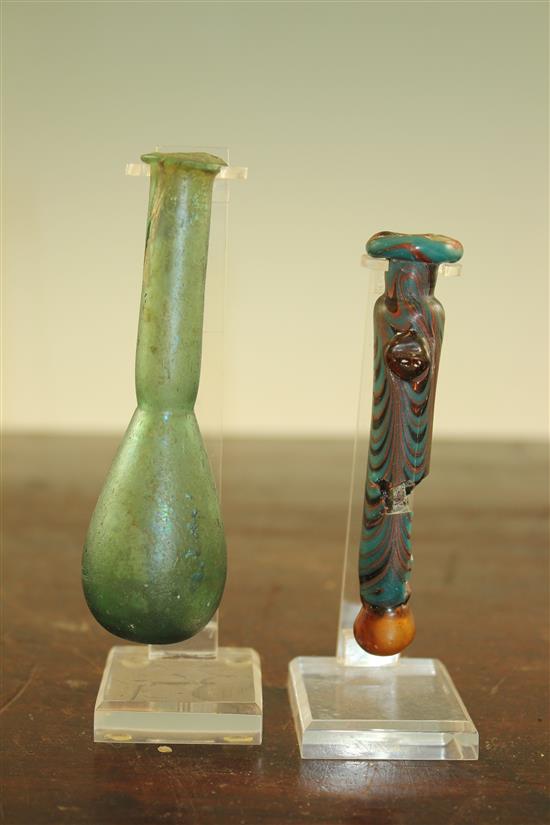 Two Roman glass unguentarium, c. 2nd century A.D., 10.5 and 12cm